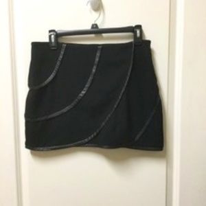 Black mini leather accent skirt